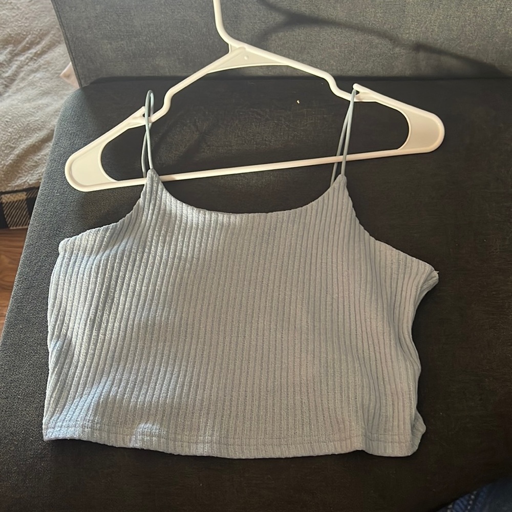 light blue tank top, unworn (because it’s too big on me) but no tags.